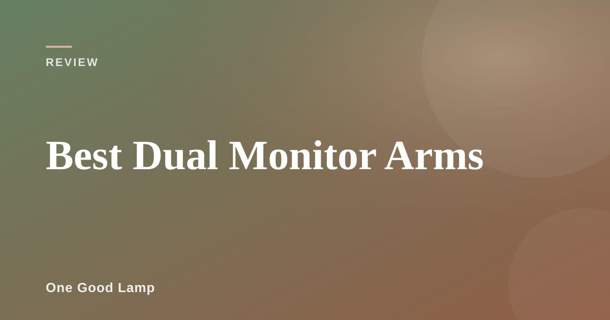 Dual monitor arm holding two screens above a clean desk